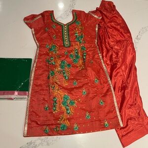 Silk blend salwaar kameez suit with embroidery and decorative details